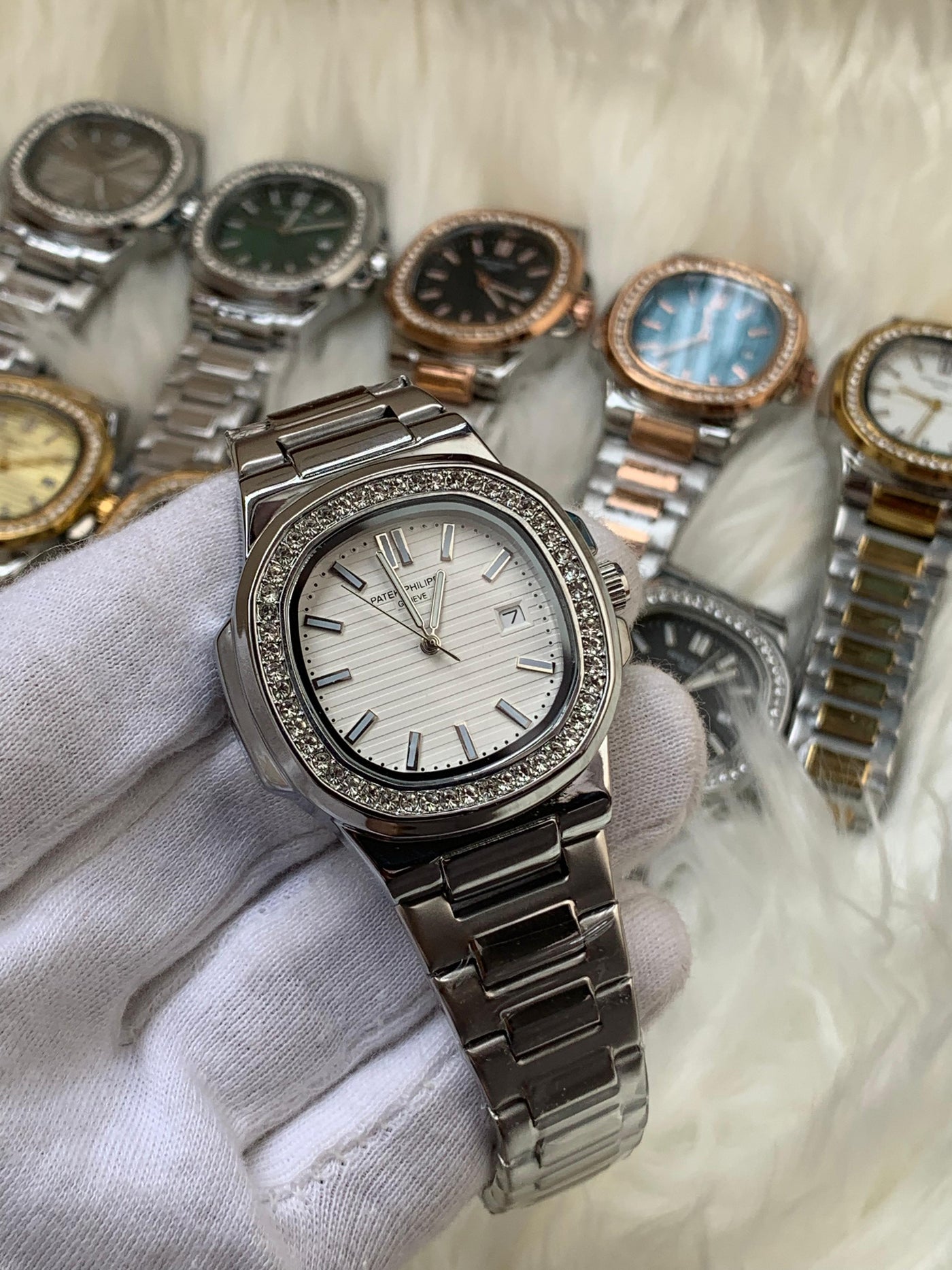 PATEK PHILIPPE- STONE BAZEL NAUTILUS