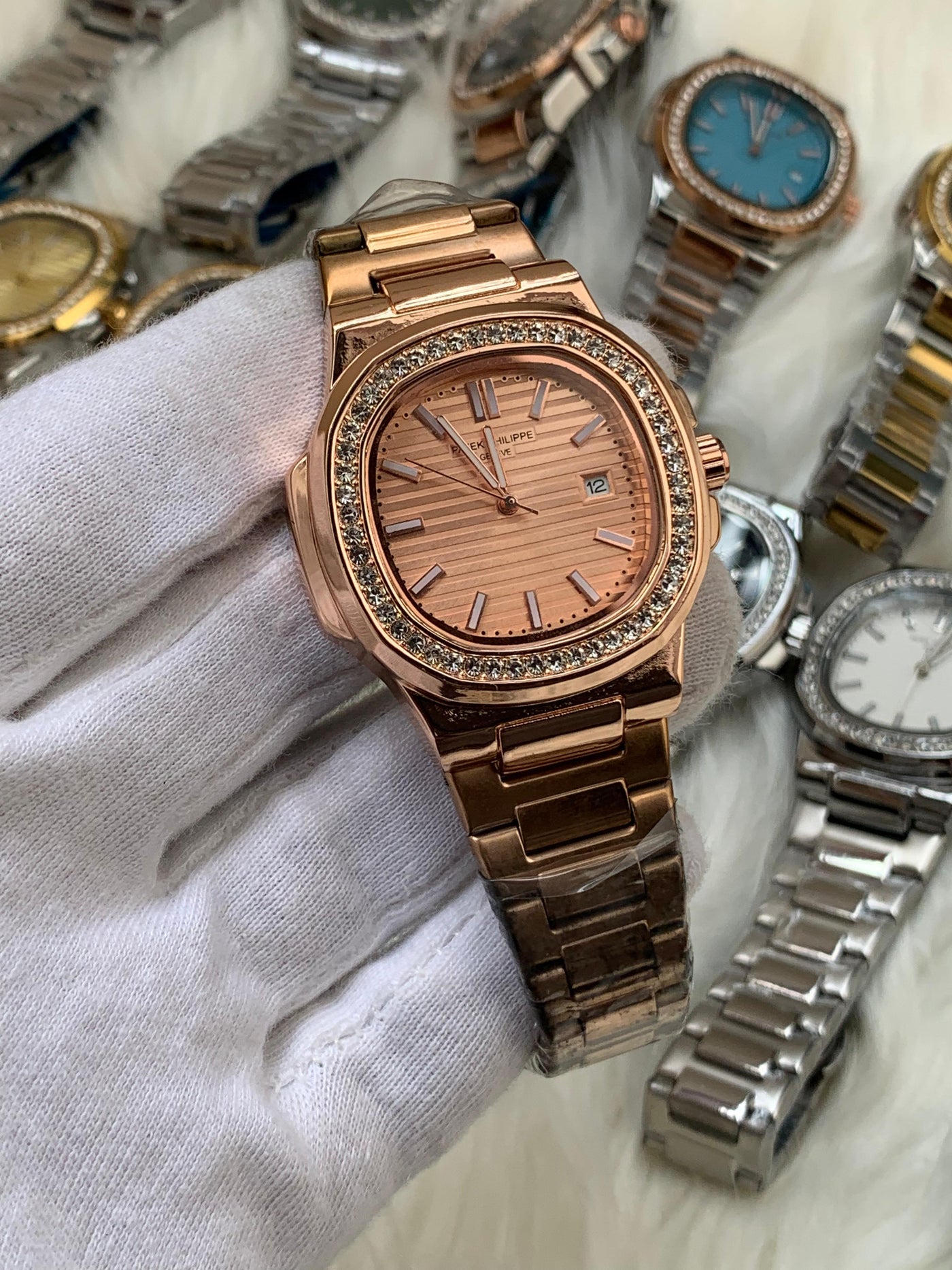 PATEK PHILIPPE- STONE BAZEL NAUTILUS