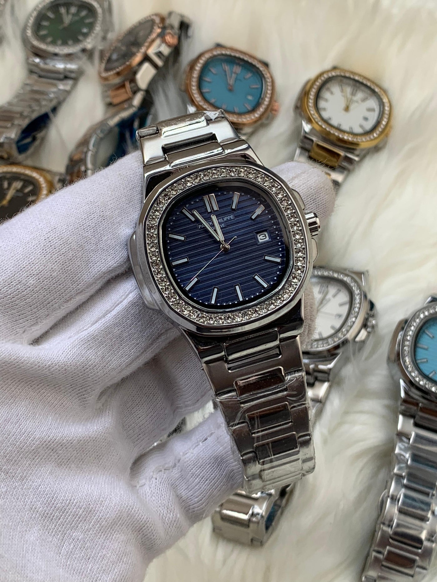 PATEK PHILIPPE- STONE BAZEL NAUTILUS