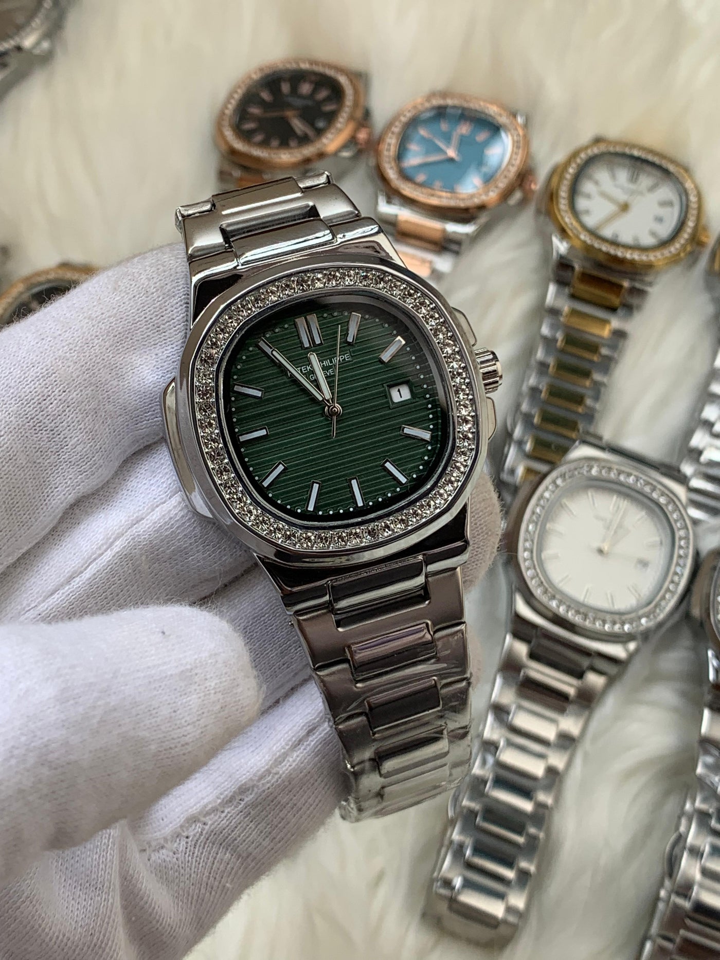 PATEK PHILIPPE- STONE BAZEL NAUTILUS