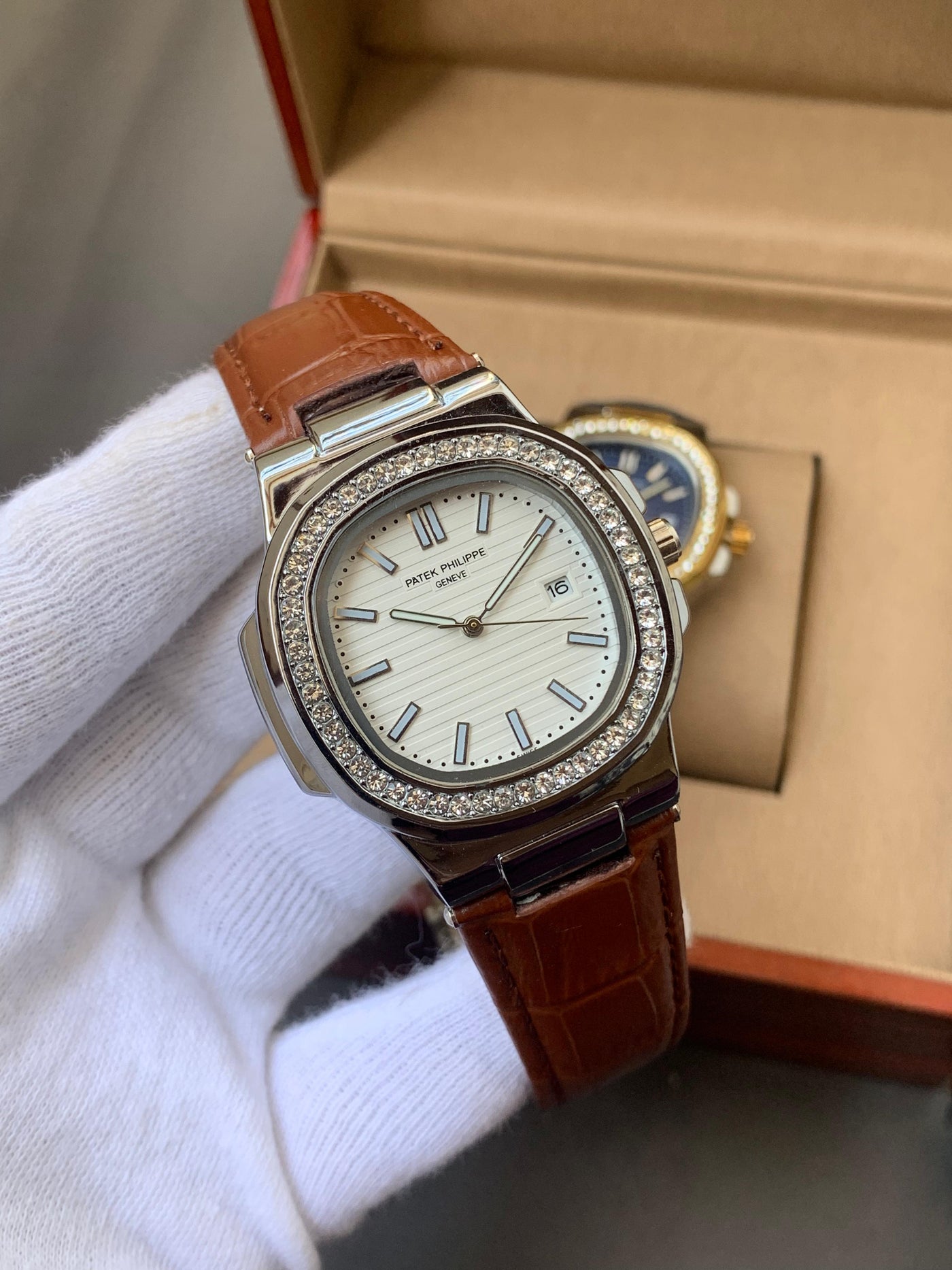 PATEK PHILIPPE- STONE BAZEL NAUTILUS